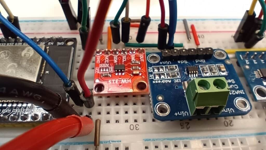 Sensors and electronic components on a breadboard for Arduino and IoT electronics projects.